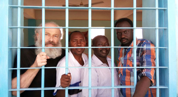 Petr in prison with the three Sudanese men