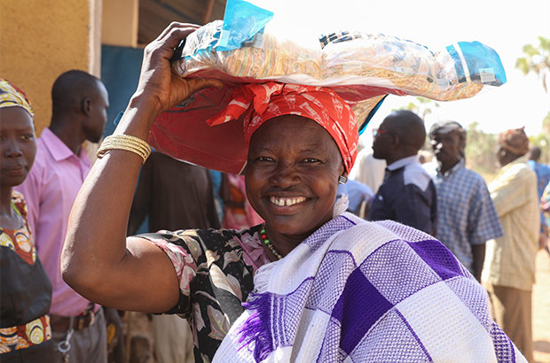 Woman carrying supplies.