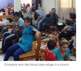 Christians who fled Mosul take refuge in a church