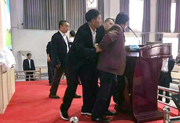 Pastor being arrested