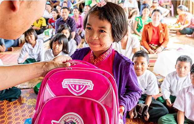 Child receiving Christmas Care Pack