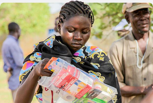 Woman holding a Family Med Pack