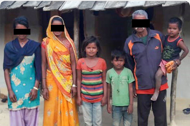 Family standing together in Nepal