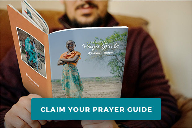 Man reading the Global Prayer Guide